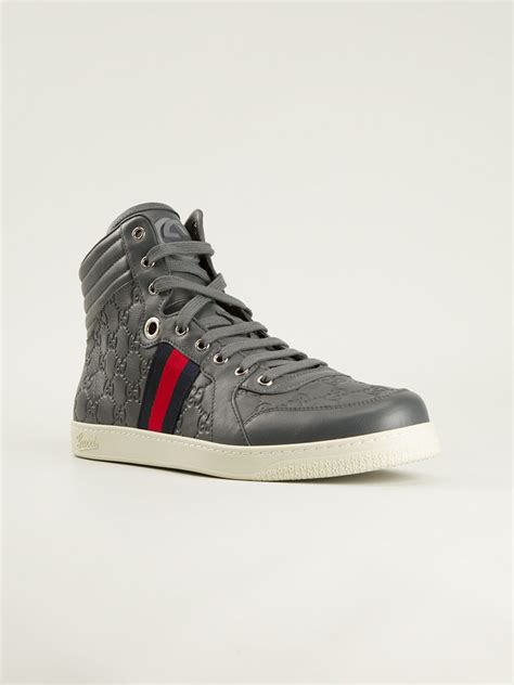 grey leather gucci sneakers.